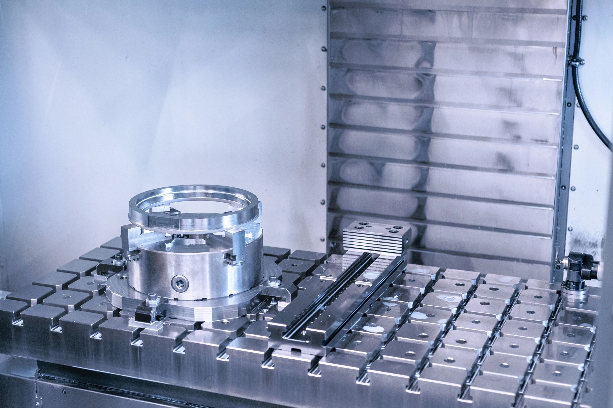 Metal component on a machine tool work panel