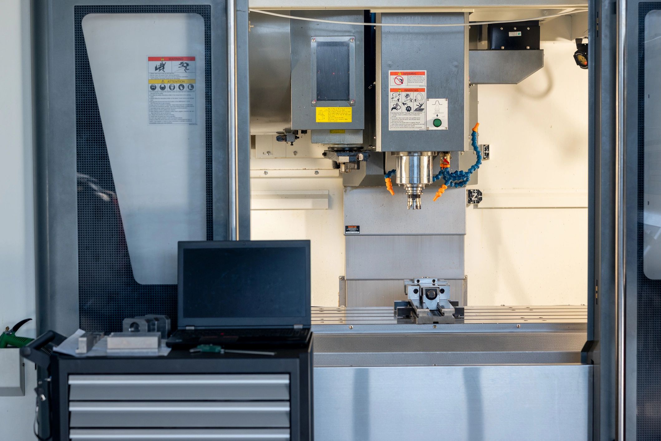 Interior of a CNC milling machine with metal workpiece